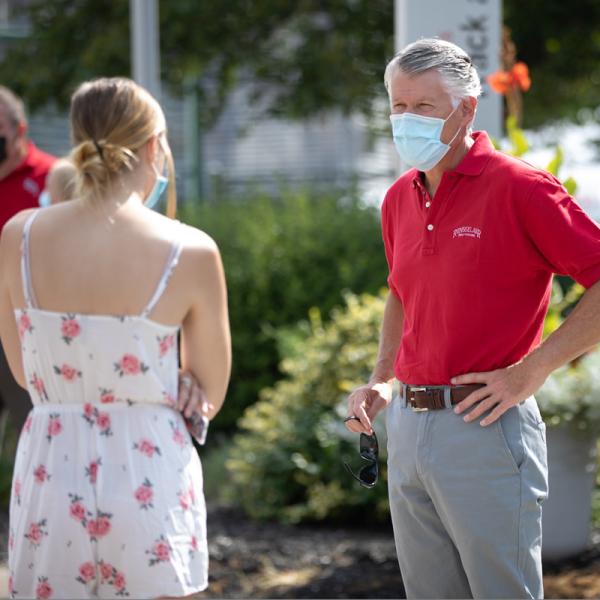 Dr. Lawrence greets a new student on moving in day.
